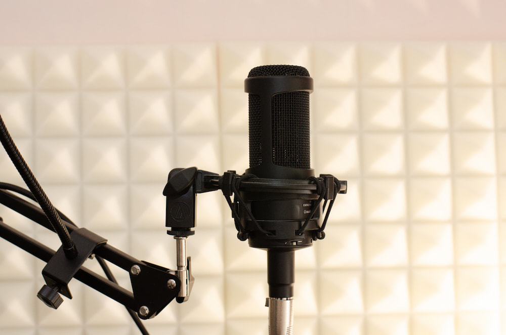 a microphone in a recording studio